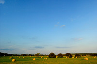 Hay Bales Under Blue Sky